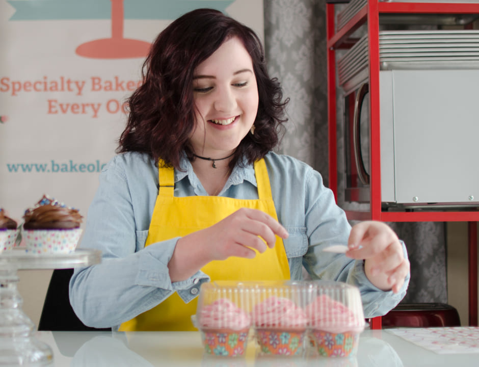 happy girl cooking cupcakes