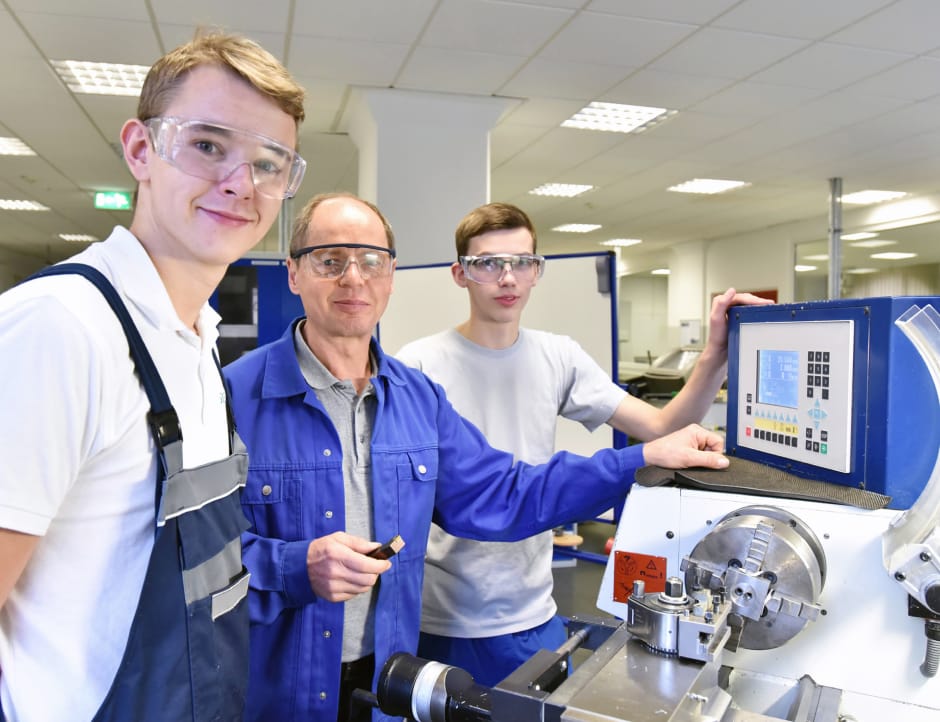 Students working in a factory